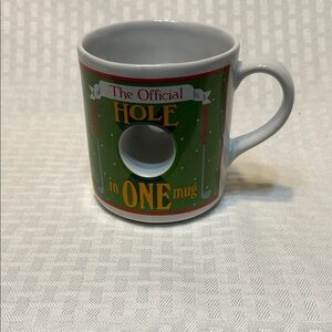 Green 'The Official Hole in One' Ceramic Golf Mug. Made in Thailand.